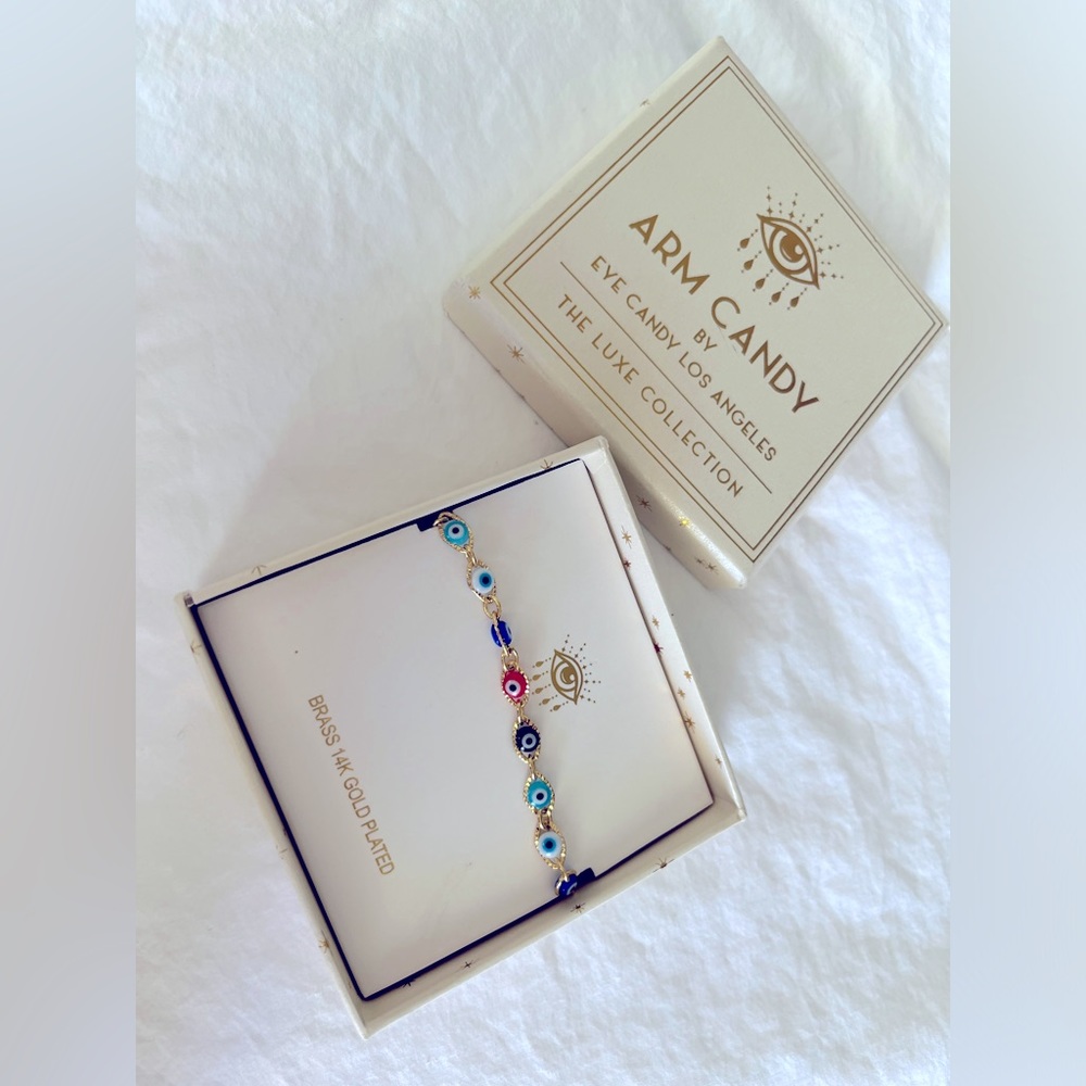 Arm candy bracelet with eyes on it, multi colored, pretty, gold